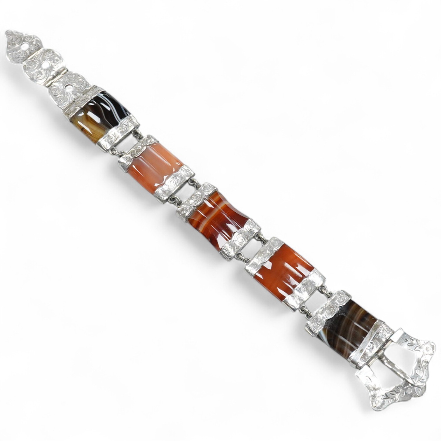 A Victorian Scottish engraved white metal and banded agate set bracelet, with buckle clasp, overall length 21.8cm.
